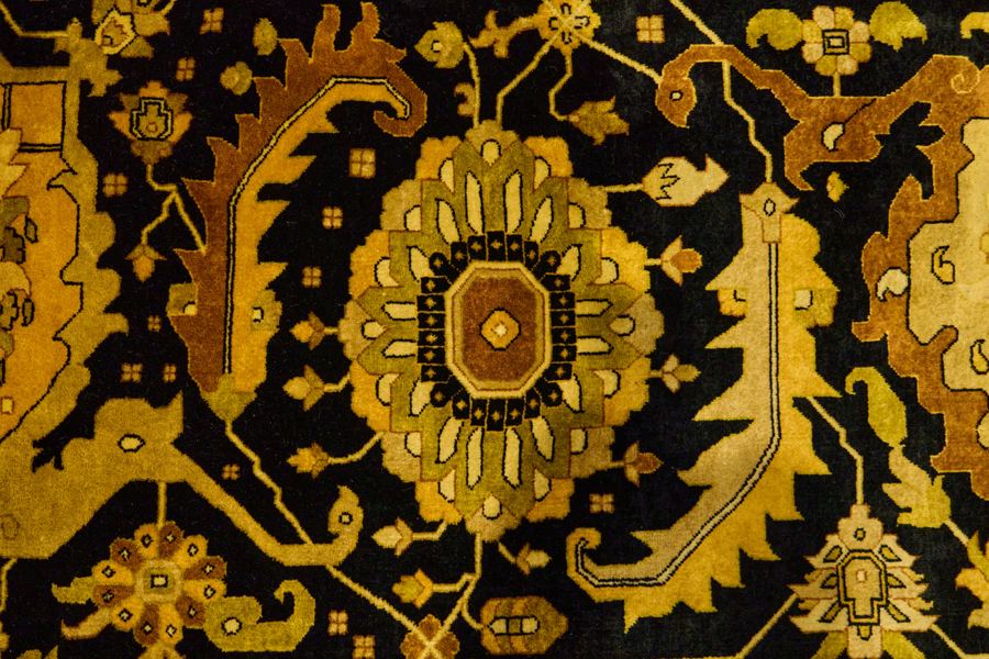 Close-up of a black and gold medallion