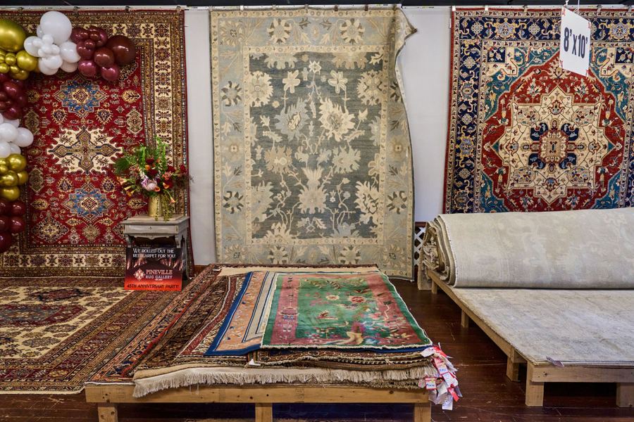 Rugs displayed on the gallery walls
