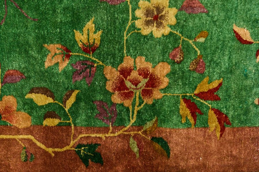 Close-up of a green floral rug